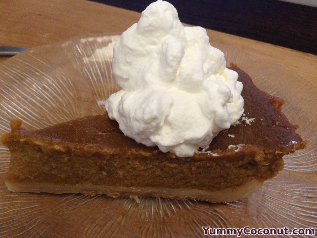 Slice of pumpkin pie with coconut milk